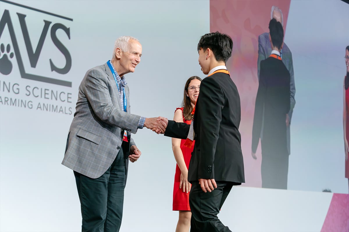 Asher Wang accepts award